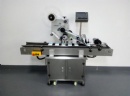 Automatic top labeling machine